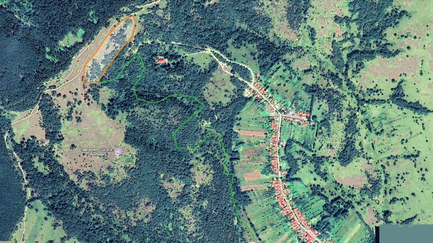 Aerial view of Gărâna village and the nearby hill where the park trails are laid out.